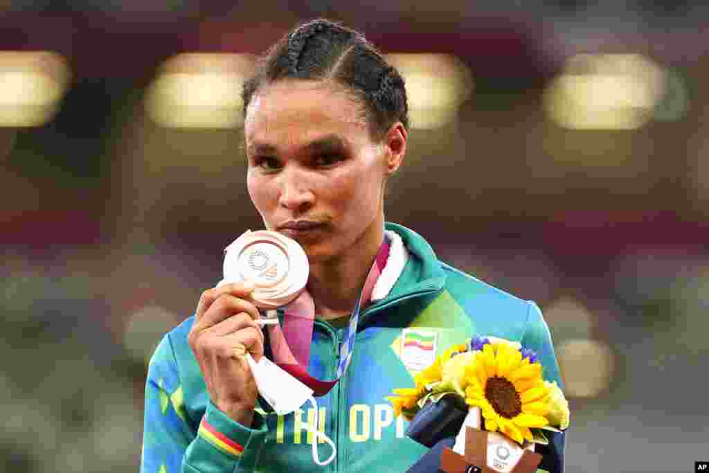 Bronze medalist Letesenbet Gidey, of Ethiopia, reacts during the medal ceremony for the women&#39;s 10,000-meters final at the 2020 Summer Olympics, Saturday, Aug. 7, 2021, in Tokyo. (AP Photo/Martin Meissner)