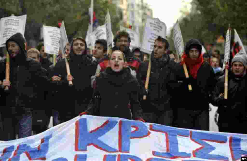 Demonstrators chant slogans during a protest in the northern port city of Thessaloniki, Greece, Wednesday, Dec. 15, 2010. At least 10 people were detained Wednesday and five were hurt, including a conservative politician who was beaten in the street by pr