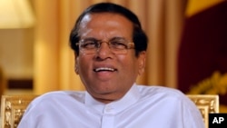 Sri Lankan President Maithripala Sirisena smiles during an interview with the Associated Press at his residence in Colombo, Sri Lanka, Tuesday, May 7, 2019.