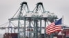 FILE - Chinese shipping containers are stored beside a US flag after they were unloaded at the Port of Los Angeles in Long Beach, California, May 14, 2019. 