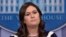 FILE - White House press secretary Sarah Sanders listens to a reporter's question during the daily briefing at the White House in Washington, May 11, 2018. 