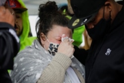 Daunte Wright's mother, Katie Wright, speaks during a candlelit vigil at the site where he was killed by police during a traffic stop, in Brooklyn Center, Minnesota, April 12, 2021.