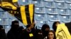 FILE - Saudi women watch a soccer match at King Fahd Stadium in Riyadh, Saudi Arabia, Jan. 13, 2018.