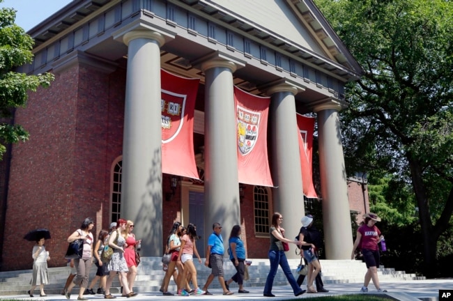 Harvard University is vowing to spend $100 million dollars to research and atone for its extensive ties with slavery, the school's president announced Tuesday, April 26, 2022, with plans to identify and support direct descendants of dozens of enslaved people who labored at the Ivy League campus. (AP Photo/Elise Amendola, File)