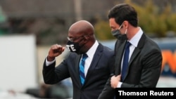 FILE PHOTO: Georgia Democratic U.S. Senate candidates Rev. Raphael Warnock at a drive-in campaign rally in Atlanta, GA.