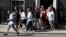 Victims of the Grenfell apartment tower block fire and volunteers leave 10 Downing Street after a meeting with Britain's Prime Minister Theresa May in London, June 17, 2017.