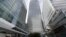 FILE - In this July 28, 2017 photo, is One Canada Square house, center, that hosts the offices of the European Banking Authority EBA, headquarters in London. 