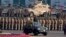 FILE - Pakistan's President Mamnoon Hussain, center on a military vehicle, reviews a military parade to mark Pakistan's Republic Day, in Islamabad, Pakistan, March 23, 2017. 