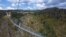 People walk across what is said to be the world's longest pedestrian bridge, in Arouca, northern Portugal, May 2, 2021. 