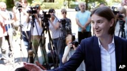 FILE - Ana Brnabic, nominated as the prime minister-designate arrives at the municipality building and waves to her supporters in Vrnjacka Banja, Serbia, June 16, 2017.
