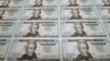 FILE: The new Series 2006 $20 currency notes, bearing the signatures of Treasury Secretary Henry Paulson and Anna Escobedo, treasurer of the United States, are seen at the Bureau of Engraving and Printing in Washington, Monday, Oct. 23, 2006. (AP Photo/J. Scott Applewhite)