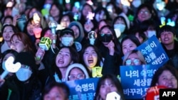 Protesters calling for the ouster of South Korea President Yoon Suk Yeol react after the result of the second martial law impeachment vote outside the National Assembly in Seoul on Dec. 14, 2024.