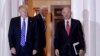  President-elect Donald Trump walks with CKE Restaurants CEO Andy Puzder from Trump National Golf Club Bedminster clubhouse in Bedminster, N.J.
