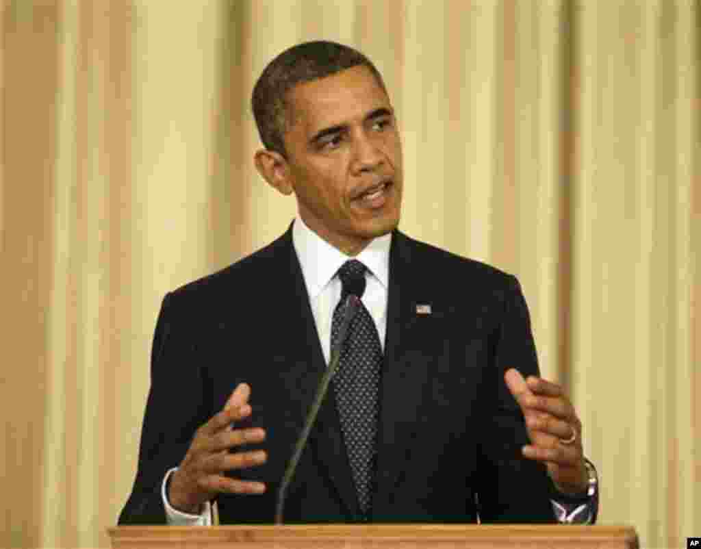 U.S. President Barack Obama gestures during a joint news conference with Thai Prime Minister Yingluck Shinawatra at Thai Government House in Bangkok, Thailand, Sunday, Nov. 18, 2012. (AP Photo/Pablo Martinez Monsivais)