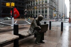 The Double Check man is seen on a nearly empty Broadway in the financial district, as the coronavirus disease outbreak continues, in New York City, New York, March 23, 2020.