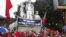 Protesters chant anti-China slogans while standing at a war martyrs monument during an anti-China protest in Hanoi, July 1, 2012.