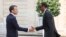 France's President Emmanuel Macron, left, welcomes Rwanda's President Paul Kagame upon his arrival at the Elysee presidential palace in Paris, France, May 23, 2018.