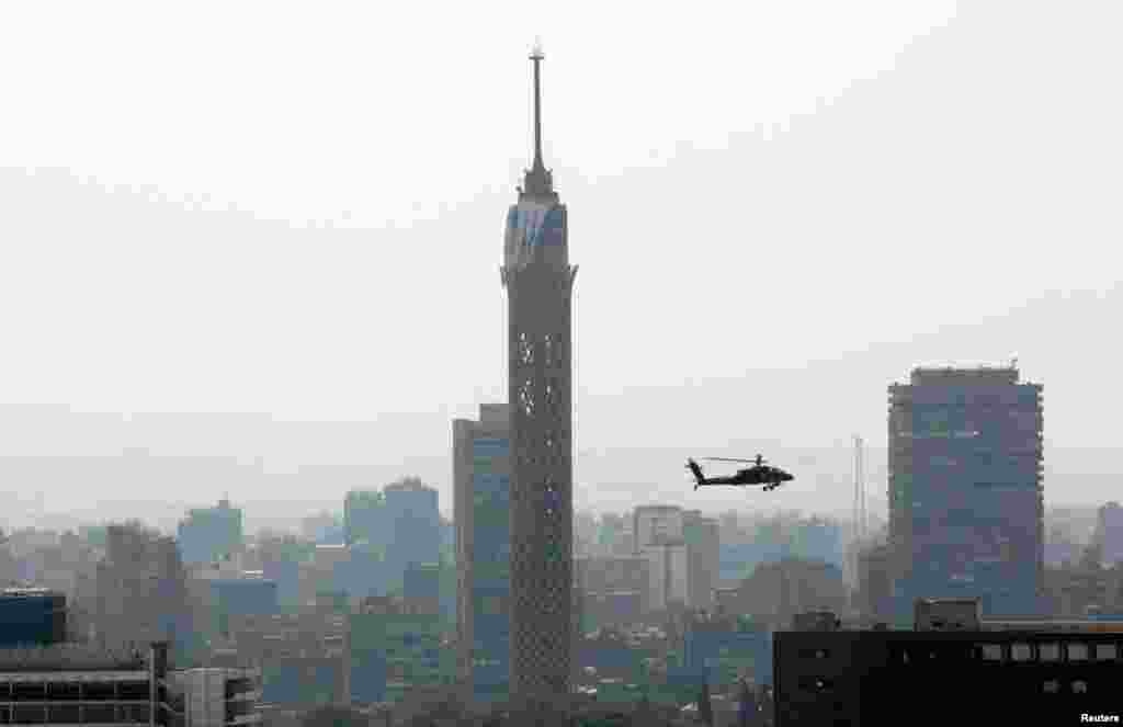 An Egyptian military helicopter near the Cairo tower, Friday, July 26, 2013.