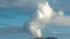 This handout photo taken on July 23, 2019 and released to AFP courtesy of Chris Firkin on Dec. 9, 2019 shows the volcano on New Zealand's White Island spewing steam and ash.