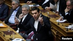 Greek Prime Minister Alexis Tsipras answers a question on the results of the latest Eurogroup during the Prime Minister's Question Time at the parliament in Athens, Greece, Feb. 24, 2017.