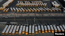 FILE - Parked school buses are seen after California issued a stay-at-home order as the spread of the coronavirus disease continues, in Los Angeles, California, U.S., April 3, 2020. (REUTERS/Lucy Nicholson/File Photo)