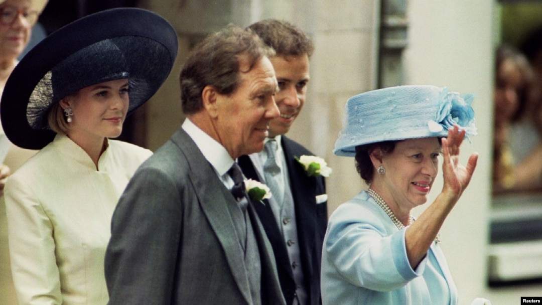 FILE - Lord Snowdon (C) and his then former wife, Princess Margeret (R), are seen leaving St. Stephen Walbrook church in London, July 14, 1994, following the wedding of their daughter, Lady Sarah Armstrong Jones (not pictured).