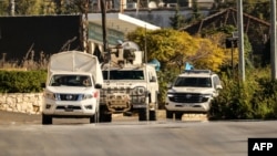 Vehicles from the United Nations Interim Force in Lebanon (UNIFIL) patrol in Marjayoun in southern Lebanon on October 12, 2024.