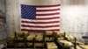 FILE - Gold bars are stacked in a vault at the U.S. Mint in West Point, N.Y., on July 22, 2014.