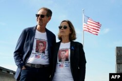 FILE — Ronen (L) and Orna Neutra, parents of Omer Neutra, pose for a photo in New York City on November 6, 2023. Omer Neutra, a dual nationality US-Israeli soldier who is one of some 240 hostages seized by Hamas. His family is counting on President Biden to get him back