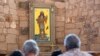 The Apache Christ painting hangs behind the altar of St. Joseph Apache Mission church in Mescalero, New Mexico, July 13, 2024. The painting was the forefront of an episode between the community and the local Diocese when it was removed by the church's then-priest.
