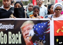 Supporters of the Communist Party of India-Marxist protest against the India visit of U.S. President Donald Trump in Mumbai, India, Feb 25, 2020.