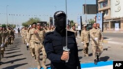 مئی 2019 میں، عراقی پاپولر موبلائزیشن فورسز بغداد، میں مارچ کر رہی ہیں۔فوٹو رائٹرز
