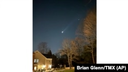 FILE - This photo provided by Brian Glenn shows what appears to be multiple drones flying over Bernardsville, N.J., Dec. 5, 2024.