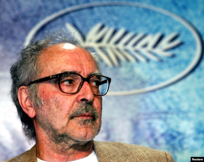 FILE - Swiss director Jean-Luc Godard listens to question during a press conference for his film entry 'Notre Musique' which is screened out of competition at the 57th Cannes Film Festival, May 18, 2004. (REUTERS/Vincent Kessler/File Photo)