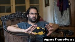 FILE - Egyptian activist and blogger Alaa-Abdel Fattah gives an interview at his home in Cairo, Egypt, May 17, 2019. 