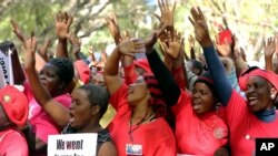 Opposition party supporters take part in a march for transparency on the streets of Harare, July 11, 2018.