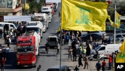 A convoy of tanker trucks carrying Iranian diesel crossed the border from Syria into Lebanon, arrive at the eastern town of el-Ain, Lebanon, Sept. 16, 2021. 