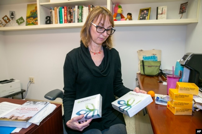 Lauren Gilbert, Center for Jewish History, Senior Manager for Public Services, in New York City Tuesday, November 29, 2022, handles Ancestry DNA test kits the center offers free to Holocaust survivors. (AP Photo/Ted Shaffrey)