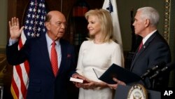 Hilary Ross, center, watches as Vice President Mike Pence swears-in new Commerce Secretary Wilbur Ross, Feb. 28, 2017, in the Vice President's ceremonial office in the Eisenhower Executive Office Building on the White House complex in Washington.