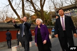 US Treasury Secretary Janet Yellen (C) and US Ambassador to China Nicholas Burns (L) visit Guozijian Hutong alley in Beijing on April 8, 2024. (Photo by Pedro PARDO / AFP)