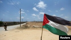 A member of Palestinian security forces loyal to Hamas patrols on border with Egypt, in Rafah in the southern of Gaza Strip, July 5, 2017.