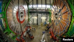 FILE - Overview of the first element (L) of the huge magnet of the CMS (Compact Muon Solenoid) experimental site at the European Organization for Nuclear Research CERN (Centre Europeen de Recherche Nucleaire) before its lowering on Thursday in the French village of Cessy in 2006.