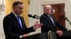 FILE - President Donald Trump, right, listens as Polish President Andrzej Duda, left, speaks during a joint news conference in the East Room of the White House in Washington, Sept. 18, 2018. 