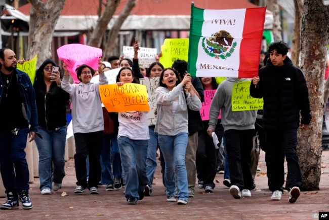 Orange County Educational Arts Academy students, escorted by teachers, protest President Donald Trump's immigration policy outside U.S. District Court in Santa Ana, Calif., Feb. 6, 2025.