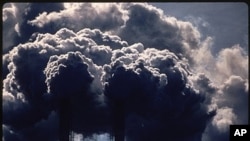 FILE: Black clouds billow from smokestacks in Houston, Texas. Taken July 1972