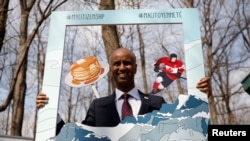 FILE - Canada's Immigration Minister Ahmed Hussen poses for photos following a citizenship ceremony at the Vanier Sugar Shack in Ottawa, Ontario, Canada, April 11, 2018.