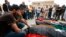 FILE - Mourners gather for funeral prayers for fighters killed by warplanes of Field Marshal Khalifa Hifter's forces, April 24, 2019, in Tripoli, Libya. 