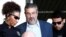 FILE - Antonio Palocci (C), former finance minister and presidential chief of staff in recent Workers Party (PT) governments, is escorted by federal police officers as he leaves the Institute of Forensic Science in Curitiba, Brazil, Sept. 26, 2016. 