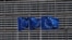 FILE - European Union flags flutter outside the EU Commission headquarters in Brussels, Belgium, May 5, 2021. 