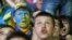 Fans of Ukraine react during a public screening of the Euro 2012 Group B soccer match between Ukraine and England in the fan zone in Kiev